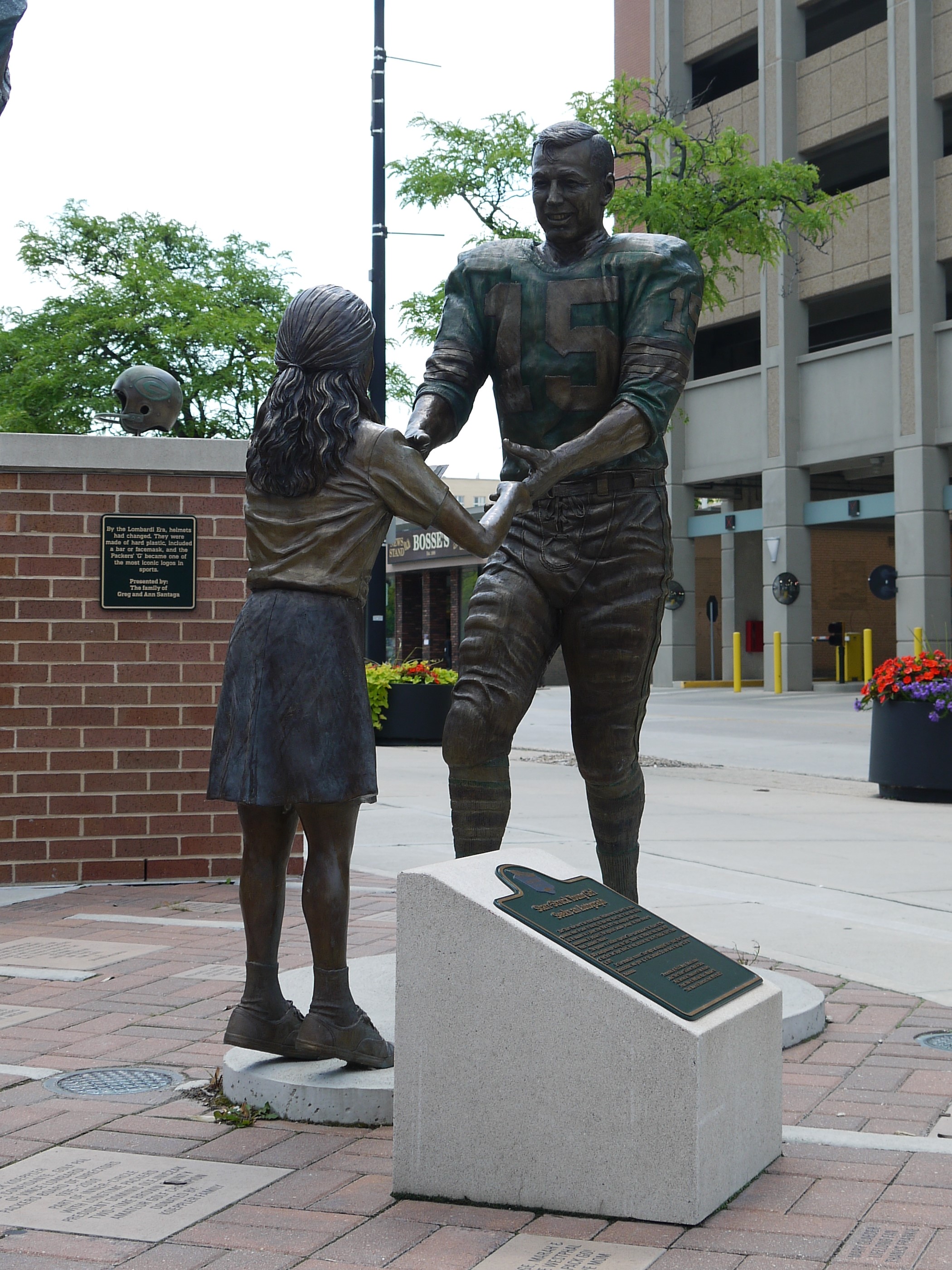 Statue of a girl asking Bart Starr for an autograph, on the Heritage Trail in Green Bay WI