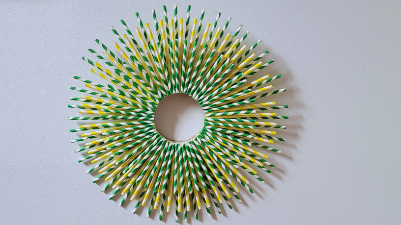 Wreath made from patterened green and yellow paper straws