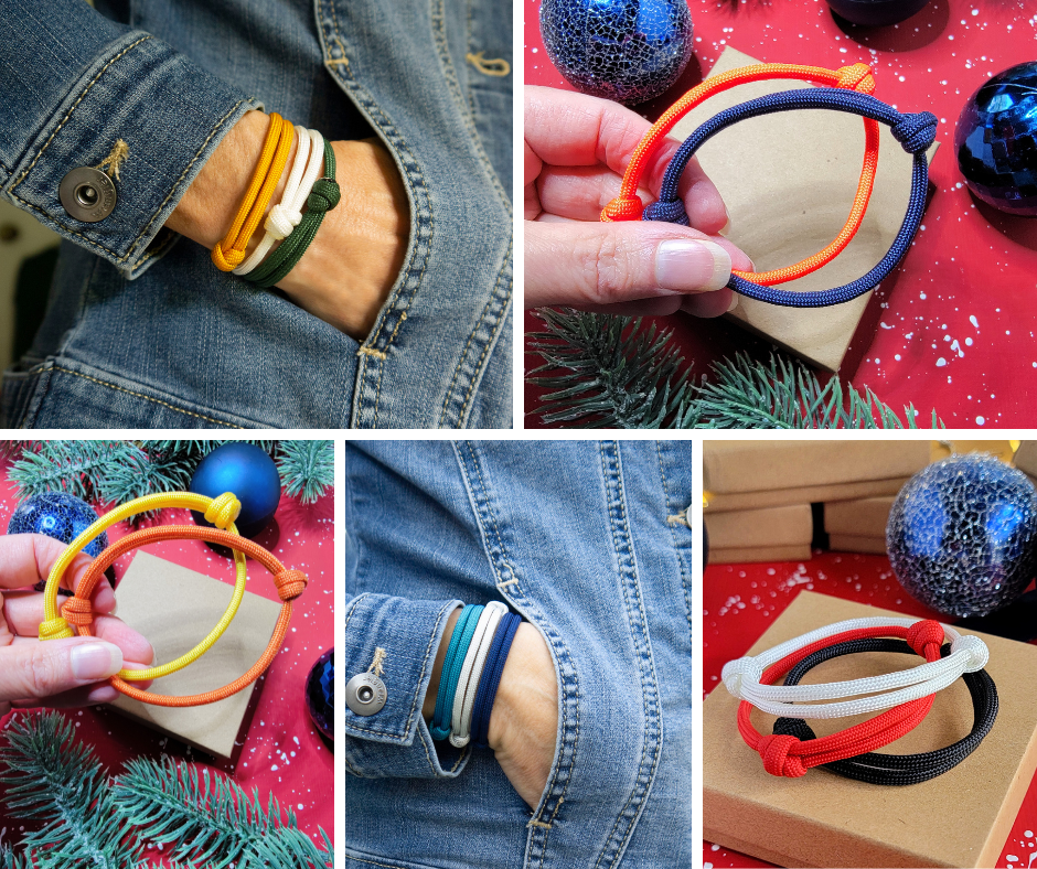 Stacks of paracord bracelets in various sports team colors.